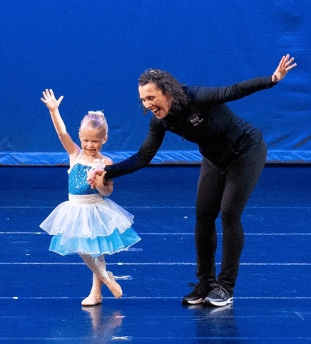 Instructor dancing with a student